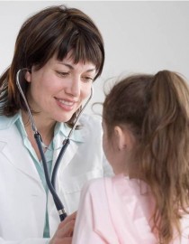 A doctor examines a young girl.
