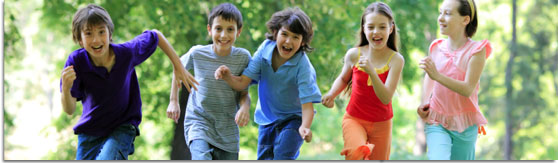 graphic banner of a group of young children running and laughing