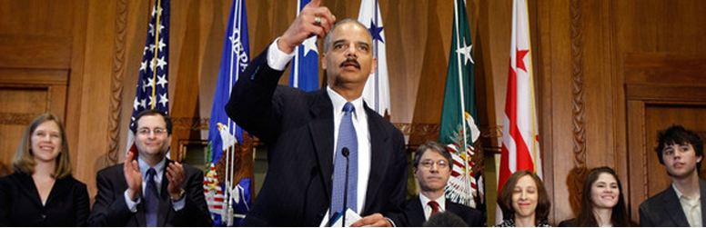 Photo of Attorney General Eric Holder flanked by Deputy Attorney General David Ogden and Associate Attorney General Tom Perrelli