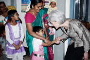 HHS Secretary Sebelius greeting a child in Belgaum, India.