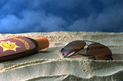 Photo: Sand, Sunglass and Sunscreen