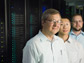 researchers in front of a supercomputer