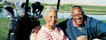 Photo: Senior couple in golf cart