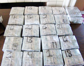 The case began when HSI and Colombian police intercepted a suspicious shipment of what was supposed to be fertilizer, but what in actuality turned out to be bundles of shrink-wrapped cash as pictured