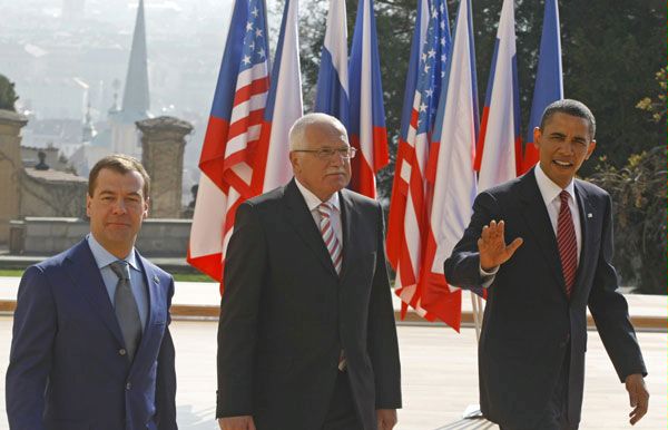 U.S. President Barack Obama, right, waves next to Czech President Vaclav Klaus, center, and Russian President Dmitry Medvedev before the signing of the New START treaty in Prague, Thursday, April 8, 2010.