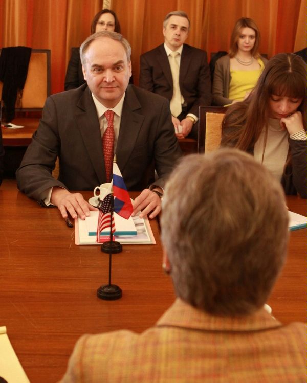 Heads of delegation, Rose Gottemoeller, U.S. Assistant Secretary of State for Verification, Compliance, and Implementation (back to camera), and Ambassador Anatoly Antonov, Director of the Department of Security and Disarmament Affairs, Foreign Ministry of the Russian Federation, sit opposite one another at the negotiating table at the Russian Mission to the United Nations in Geneva.