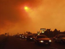 Cars leaving a wildfire area