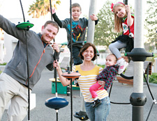Family posing on playground