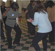 Photo of a diverse group clapping and dancing.