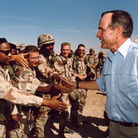 President George H.W. Bush greeting the U.S. soldiers in Iraq during the Gulf War.