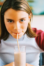 Girl drinking chocolate milk