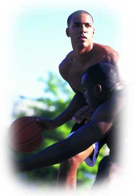 Two men playing basketball