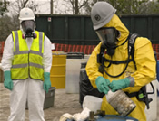 An environmental specialist carefully disposes of chemicals that Hurricane Rita spilled