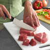 cutting meat on a cuttingboard