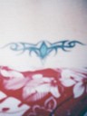 Tribal tattoo on her lower back