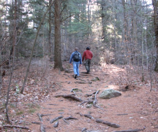 Hikers explore a trail at Wapack National Wildlife Refuge in New Hampshire.