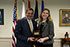 Angela Wilson, the Defense Department Education Activity's Teacher of the Year, accepts an award from Defense Secretary Leon E. Panetta