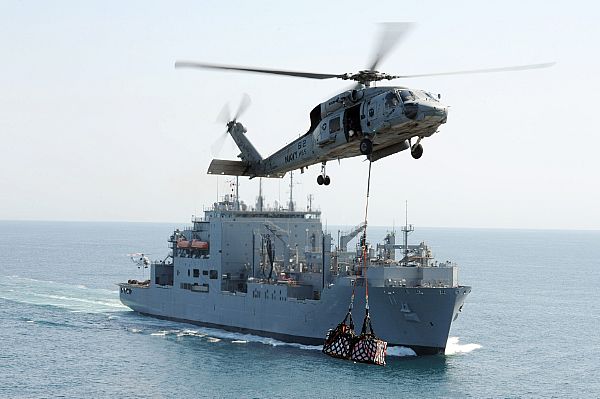 An SH-60F Sea Hawk helicopter assigned the Nightdippers of Helicopter Anti-submarine Squadron (HS) 5 transfers supplies from the Military Sealift Command dry cargo and ammunition ship USNS Washington Chambers (T-AKE 11) to the Nimitz-class aircraft carrier USS Dwight D. Eisenhower (CVN 69), not pictured, during a vertical replenishment. Dwight D. Eisenhower is deployed to the U.S. 5th Fleet area of responsibility conducting maritime security operations, theater security cooperation efforts and support missions as part of Operation Enduring Freedom. The U.S. Navy is constantly deployed to preserve peace, protect commerce, and deter aggression through forward presence. Join the conversation on social media using #warfighting.  U.S. Navy photo by Mass Communication Specialist 3rd Class Ryan D. McLearnon (Released)  121011-N-GC639-053