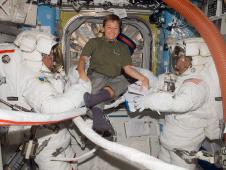 Pictured here on Oct. 28, 2007, Whitson, takes a moment to pose for a photo with astronauts Scott Parazynski (left), STS-120 mission specialist, and Daniel Tani, Expedition 16 flight engineer, as they prepare for the mission's second session of extravehicular activity (EVA).