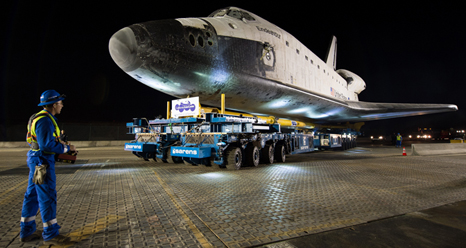 The driver of the overland transporter maneuvers the space shuttle Endeavour on the streets of Los Angeles as it heads to its new home at the California Science Center early in the morning on Friday, Oct. 12, 2012.
