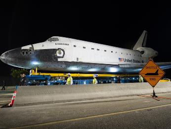 The space shuttle Endeavour is seen atop the Over Land Transporter (OLT) after exiting the Los Angeles International Airport on its way to its new home at the California Science Center in Los Angeles, Friday, Oct. 12, 2012.