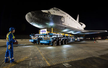 The driver of the Over Land Transporter is seen as he maneuvers the space shuttle Endeavour on the streets of Los Angeles as it heads to its new home at the California Science Center, Friday, Oct. 12, 2012.