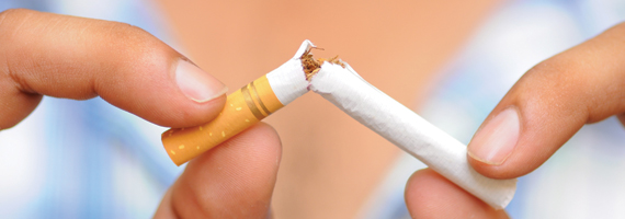 A photograph of a cigarette being broken in half