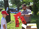 A park ranger demonstrates how to properly wear a life jacket.