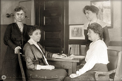 Children’s Bureau Chief, Julia Lathrop, meets with staff to plan Baby Week, circa 1916.