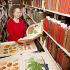 Special Collections librarian Sara B. Lee selecting fruit and vegetable images from the Rare Book Collection.