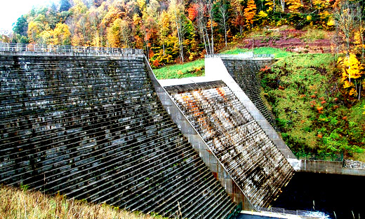 The Elkwater Fork Dam on the Tygart River in Randolph County, WVA is surrounded by fall foliage. USDA's Natural Resources Conservation Service provided assistance in the design and construction of the dam.