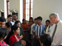 A photo of Dr. Francis Collins with young scientists in India. 