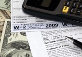Calculator, tax forms, money