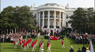 The U.S. Army Old Guard Fife and Drum Corps marches across the South Lawn during the official arrival ceremony for Prime Minister Junichiro Koizumi of Japan, June 29, 2006. 