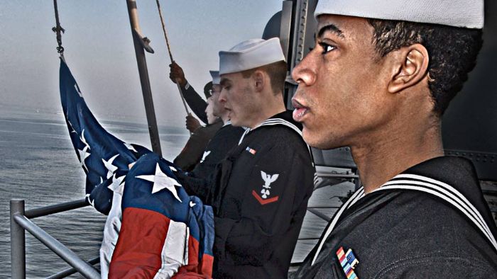 Sailors prepare to raise the American Flag during morning colors. 