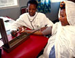 A midwife measures the blood pressure of a pregnant woman in an antenatal clinic.