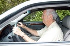 Photo of a man driving a car. - Click to enlarge in new window.