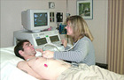 Doctor performing an echocardiogram. - Click to enlarge in new window.