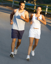 Photo: A man and woman jogging.