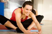 A woman stretches during a yoga class