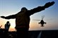 U.S. Navy Petty Officer 3rd Class Jean Petitfrere signals a U.S. Army AH-64 Longbow Apache helicopter to land on the flight deck of the amphibious dock landing ship USS Gunston Hall in the Arabian Sea, Oct. 9, 2012. The Gunston Hall and the embarked 24th Marine Expeditionary Unit  are part of the Iwo Jima Amphibious Ready Group, and deployed to support maritime security operations and theater security cooperation efforts in the U.S. 5th Fleet area of responsibility.  U.S. Navy photo by Petty Officer 3rd Class Jonathan Sunderman