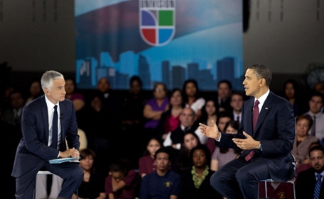 President Barack Obama talks with moderator Jorge Ramos at a Town Hall Meeting hosted by Univision.