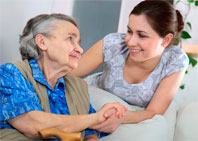 Elderly woman and her caregiver