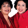 Two women pose on the cover of Spanish materials.