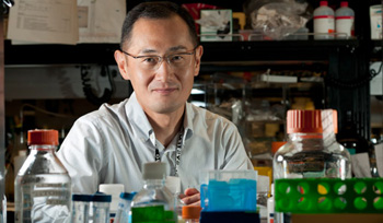 Head shot of scientist at a lab bench