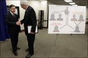 FBI Special Agent in Charge of Dallas Field Office, Robert E. Casey, left, shakes hands with W. Rick Copeland, Director of the Medical Fraud Control Unit of the Office of the Texas Attorney General, next to a chart outlining a health care fraud scheme after a news conference on February 28, 2012 in Dallas. Officials announced that a physician and the office manager of his medical practice, along with five owners of home health agencies, were arrested on charges related to their alleged participation in a nearly $375 million health care fraud scheme involving fraudulent claims for home health services. For more details, see http://www.fbi.gov/dallas/press-releases/2012/dallas-doctor-arrested-for-role-in-nearly-375-million-health-care-fraud-scheme. (AP Photo/LM Otero)