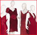 Four red dresses on mannequin display during Mercedes-Benz Fashion Week 2003