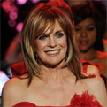 Linda Gray wears a red dress at Mercedes-Benz Fashion Week 2011