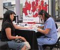 2010 Road Show - A woman has her cholesterol checked at The Heart Truth Road Show in Albuquerque, NM.