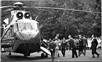 President Lyndon B. Johnson stepping off helicopter onto the lawn of the NIH Clinical Center, August 9, 1965.